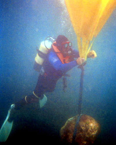 Seadart Diver Chris lifting a large rock with air bags.